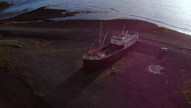 The oldest boat Gardar BA 64 in North West Iceland at sunset