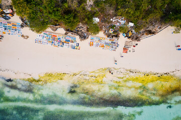 The picturesque Nungwi beach in Zanzibar, Tanzania is showcased in a toned aerial view image, highlighting the luxury resort and turquoise ocean waters.