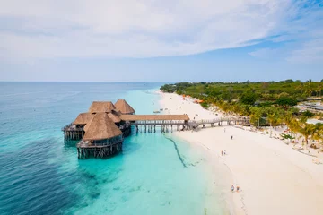 Foto op Plexiglas Nungwi Strand, Tanzania The picturesque Nungwi beach in Zanzibar, Tanzania is showcased in a toned aerial view image, highlighting the luxury resort and turquoise ocean waters.