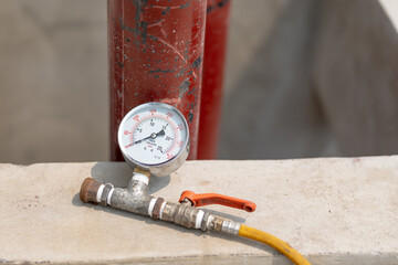 Pressure gauge, a close-up measuring instrument in a pneumatic control system.