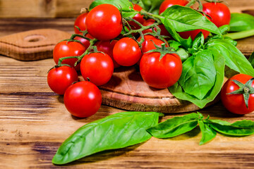 Heap of small cherry tomatoes on wooden table