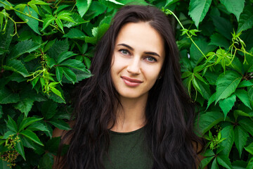 Young beautiful brunette woman in summer dress