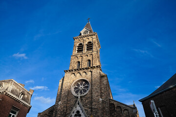 Eglise des Notre dame des anges church in liege, Belgium. it's a parish catholic church, with its typical clocktower steeple. - obrazy, fototapety, plakaty