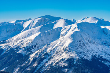Fototapeta na wymiar Poland 2022. Beautiful view on the snow Tatry. Zakopane, Giewont, Kasprowy Wierch, Swinica, Rysy, Kresanica