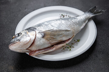 sea bream fresh fish seafood raw ready to cook healthy meal food snack on the table copy space food background rustic top view pescatarian diet