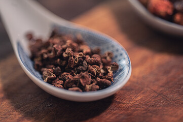 peppercorns on spoon