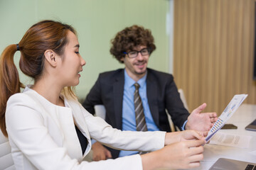 Fototapeta premium Shot of two businessperson discussion with the document and computer laptop in the office.