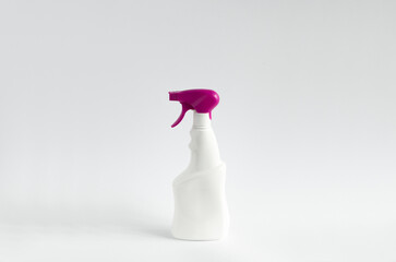 White blank plastic spray detergent bottle with a violet sprayer isolated on white background. Packaging template mockup.