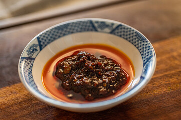 a bowl of chili sauce