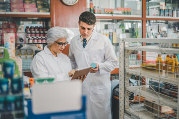 skilled pharmacist is consulting, analyzing the use of drugs to recommend and supervise patients according to prescriptions in modern pharmacies.