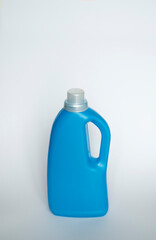 Softener in blue plastic bottle isolated on white background. Bottle with liquid laundry detergent, cleaning agent, bleach or fabric softener. Product design. Mock up.