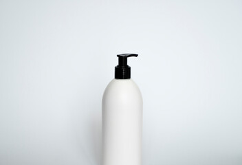 Liquid container for gel, lotion, cream, shampoo, bath foam. Cosmetic plastic bottle with black dispenser pump.