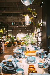 View of assortment of decor for interior shop in store of shopping center. Home accessories and household products for dining room in store of shopping centre. View of beautifully set table. Home