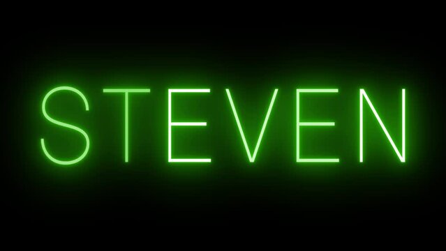 Flickering green retro style neon sign glowing against a black background