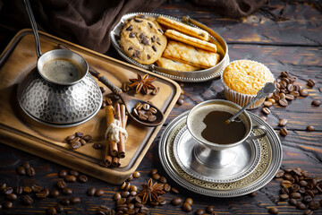 Espresso coffee with coffee beans on old background.