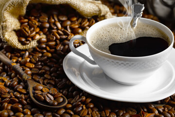 Espresso coffee with coffee beans on old background.