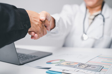 healthcare business success finance concept. doctors people medical, or businessman in hospital contact accountants to check cost of equipment medical. stethoscope, chart, paperwork, laptop, and graph