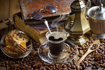 Espresso coffee with coffee beans on old background.
