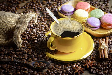 Espresso coffee with coffee beans on old background.