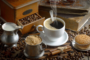 Espresso coffee with coffee beans on old background.