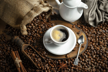 Espresso coffee with coffee beans on old background.