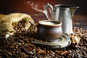 Espresso coffee with coffee beans on old background.