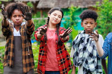 diverse teenage boy and girls show hand dirty