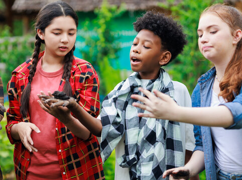 diverse teenage boy and girls show hand dirty