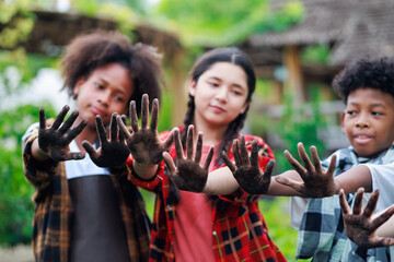 diverse teenage boy and girls show hand dirty