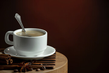 Espresso coffee with coffee beans on old background.