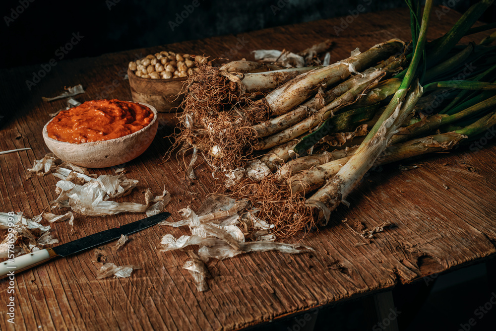 Wall mural raw calcots and romesco sauce of catalonia