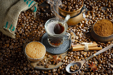 Espresso coffee with coffee beans on old background.