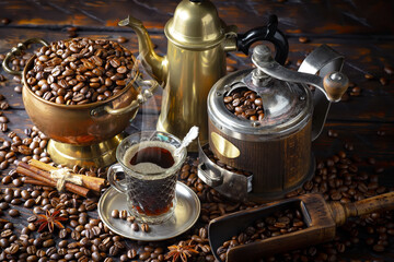 Espresso coffee with coffee beans on old background.