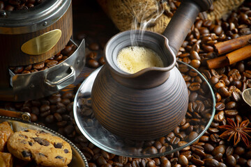 Espresso coffee with coffee beans on old background.