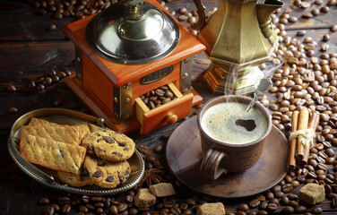 Espresso coffee with coffee beans on old background.