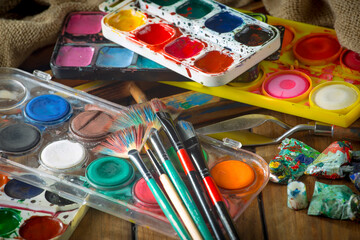 Paints and brushes for drawing. Artistic creativity.