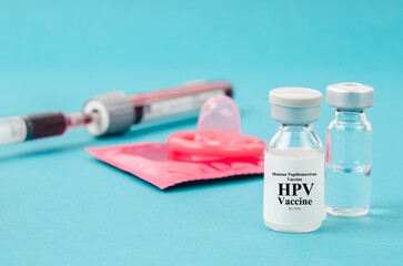 The Drug vial Human Papillomavirus : Hpv vaccine and condom with sample blood for test in blood...