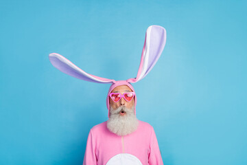 Portrait of funky astonished positive elderly pensioner wear pink bunny costume impressed staring...