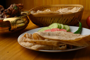 Saoji or savji chicken is a popular Indian food consists of poultry meat, served with chapati ,rice, salad 