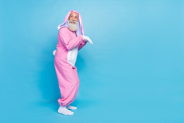 Side profile full size photo of optimistic overjoyed funny elderly pensioner wear pink bunny...