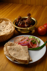 Chicken curry with chapatiroti, popular indian lunchdinner menu. served with salad.