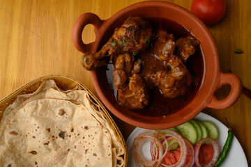 Saoji or savji chicken is a popular Indian food consists of poultry meat, served with chapati ,rice, salad 