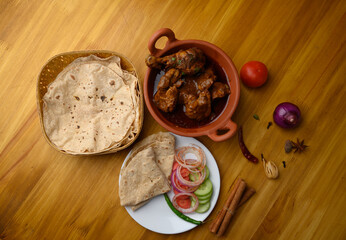 Saoji or savji chicken is a popular Indian food consists of poultry meat, served with chapati ,rice, salad 