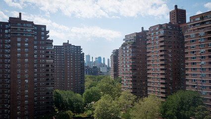 Lower East Side apartment blocks in New York with skyscrapers visible in the background.