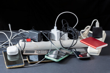Gadgets connected for charging. Charging from a generator during a disaster. Communication support for victims of disasters.