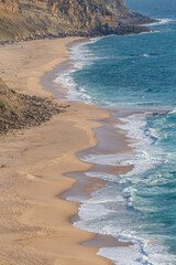 Ocean waves and sand beach in Portugal
