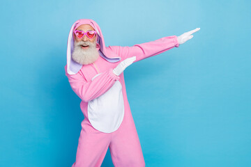 Portrait of funky optimistic elderly pensioner wear pink bunny costume indicating empty space have...