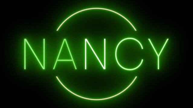 Flickering green retro style neon sign glowing against a black background