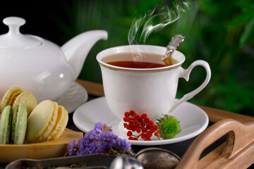 Sweet, hot tea with dessert, on an old background.