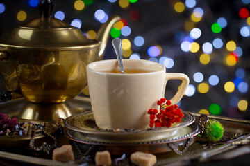 Sweet, hot tea with dessert, on an old background.